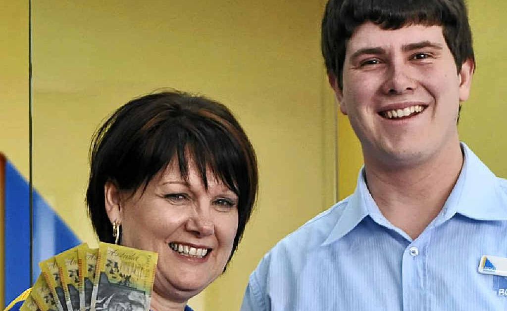 Dianne Crowe and Travis Payne from Bank of Queensland, with $50 notes similar to those a winner will be able to draw out of their $1000 account on offer in our Monster Rodeo Giveaway. Entries close tomorrow at 3pm.